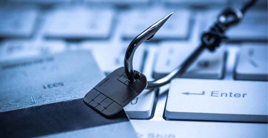 Spear-Phishing Fish Hook with Computer Chip on Keyboard
